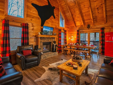 Unwind in your spacious log cabin living room with soaring ceilings