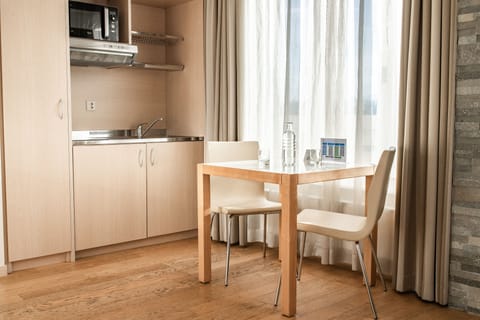 Studio Suite, 1 Bedroom | Premium bedding, down comforters, in-room safe, individually furnished