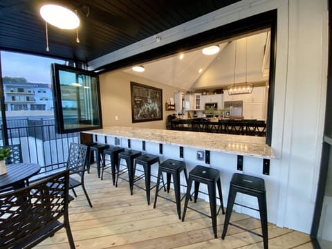 Main level screened in deck window ups up to dining area
