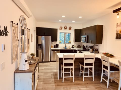 Kitchen and dining space with fully stocked kitchen for cooking