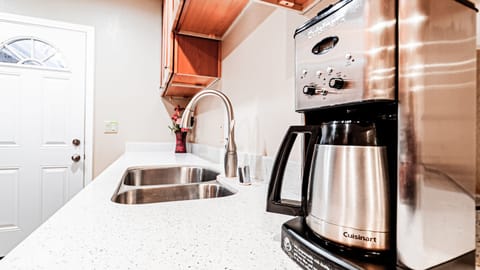 Kitchen with cooking wares and utensils