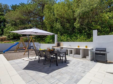 Table, Furniture, Chair, Outdoor Table, Shade, Outdoor Furniture, Tree, Architecture, Road Surface, Building