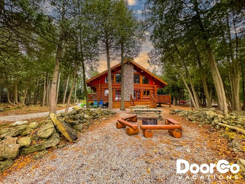Custom Canadian log cabin with stunning waterfront views.