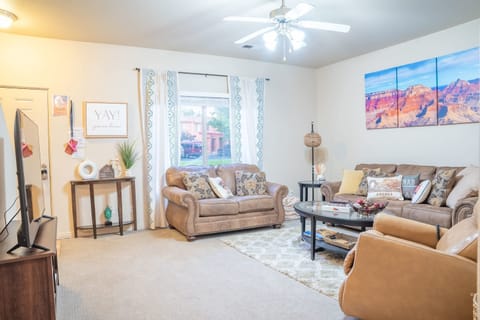 Living room with comfortable couches and a luxurious massage chair!
