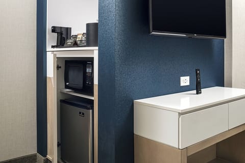 Desk, laptop workspace, iron/ironing board, free cribs/infant beds