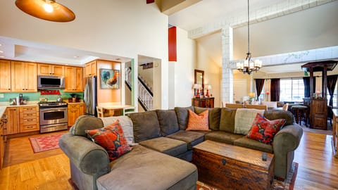 Kitchen and TV room that opens up to the rest of the main floor.