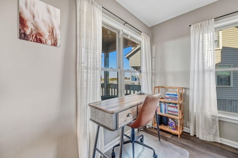 Desk looks out onto deck and dunes. High speed WiFi and boosters in the house.