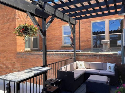 The pergola-covered back deck offers a city view to the eastern foothills and sightings of the old historic post office and one of the longest operating original hardware stores in the country, Sheridan Commercial.
