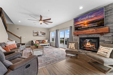 Great Room with fireplace and 70" smart TV