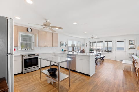 Fully stocked kitchen with dishes and utensils for 16 guests. Gas stove.