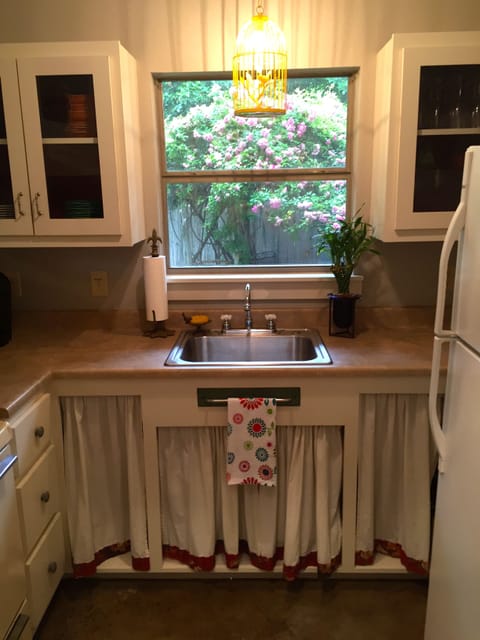 Kitchen with cooktop, stove, microwave, & refrigerator