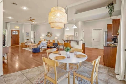 Dining area: Share meals at a dining table overlooking the sunroom and backyard garden.