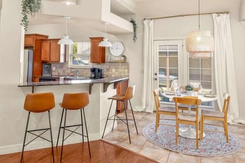 Dining area: Share meals at a table overlooking the sunroom and backyard garden.