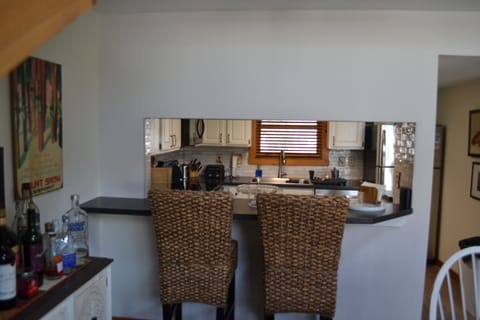 Kitchen with bar stools.