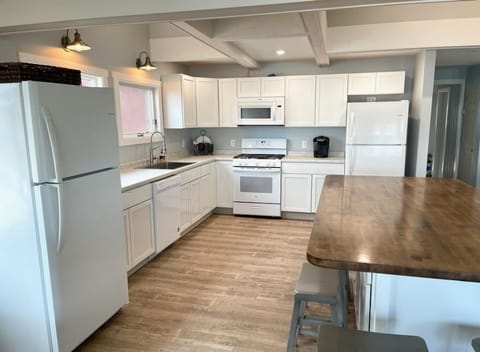 Great room-kitchen, large island, two fridges