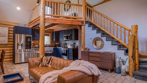 View of kitchen and stairs up to loft and master bedroom