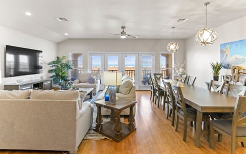 Spacious  living area that leads to a balcony with views of the Gulf