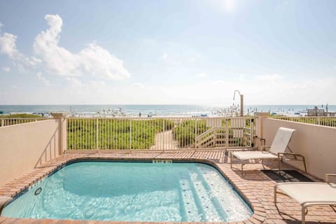 Our private pool overlooks South Padre Island's luscious sand dunes and warm waves.