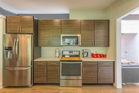 Kitchen - Open-concept kitchen features all new cabinetry and stainless-steel appliances.