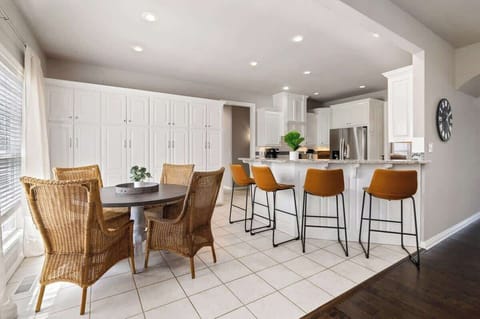 Next to this living room is a secondary dining space that seats 4 + 4 barstools at our kitchen bar.