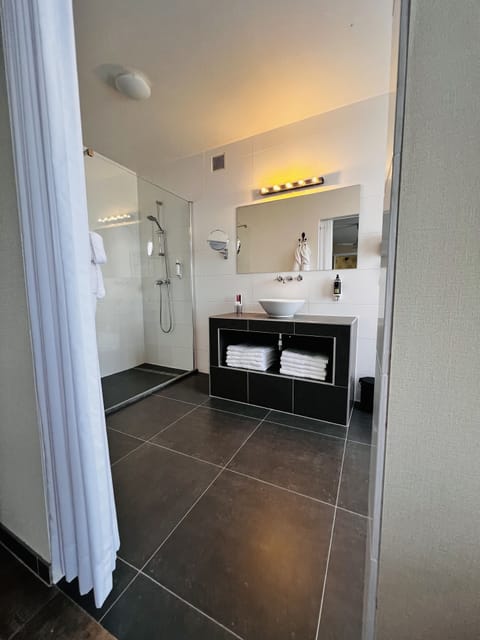 Designer toiletries, hair dryer, bathrobes, towels