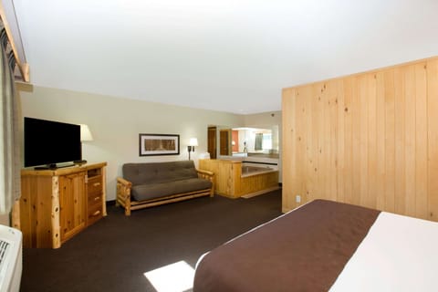 Premier King Suite, 1 Bedroom,1 King Bed, Jacuzzi, Fireplace, Non Smoking | Desk, iron/ironing board, rollaway beds, free WiFi