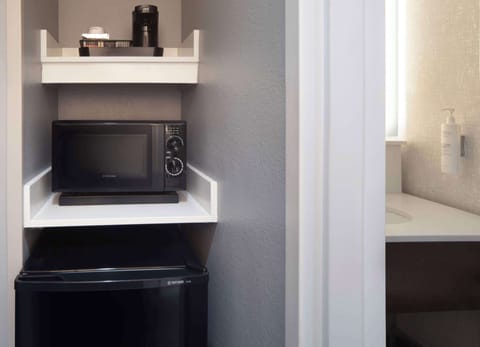 Desk, laptop workspace, blackout drapes, iron/ironing board