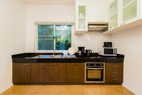 Fridge, microwave, stovetop, coffee/tea maker