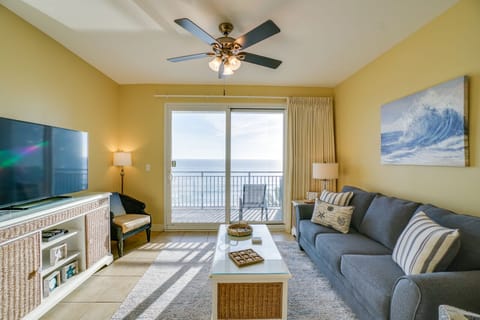Unwind in your bright coastal living room with ocean views through sliding doors to your private balcony.