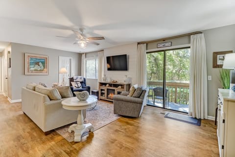 Beautifully Furnished Spacious Great Room with a Flat Screen Smart TV, Electric Fireplace, and a Private Balcony