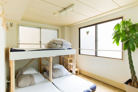 Economy Triple Room | Down comforters, desk, iron/ironing board, free WiFi