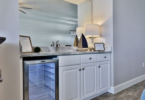 Bar with drink fridge.