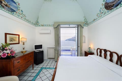 Deluxe Double Room, Sea View | Premium bedding, minibar, in-room safe, individually decorated