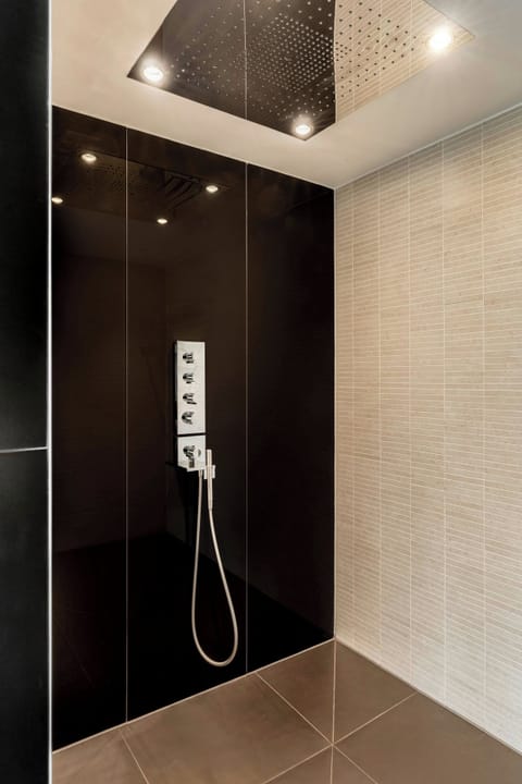 Designer toiletries, hair dryer, bathrobes, slippers