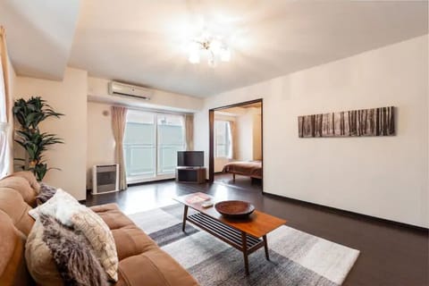 Apartment, Non Smoking | Living area | Flat-screen TV