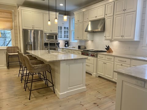 Recently remodeled kitchen with Wolf gas cooktop and new countertops