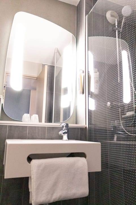 Shower, eco-friendly toiletries, hair dryer, towels