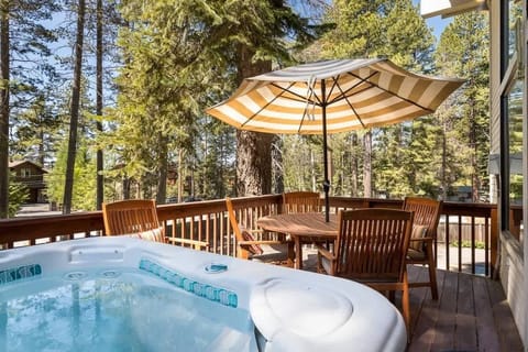 Hot tub is located on the upper patio off the living room on the front side (Lake side) of the home. 