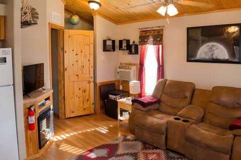 Bright, cozy tiny home living space with desert views.