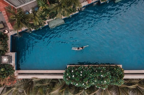 Outdoor pool, open 7:00 AM to 10:00 PM, pool umbrellas, sun loungers