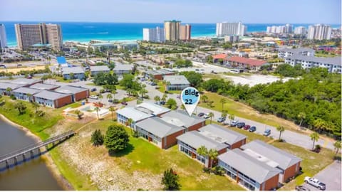 Aerial view of beach front with your condo building in the foreground