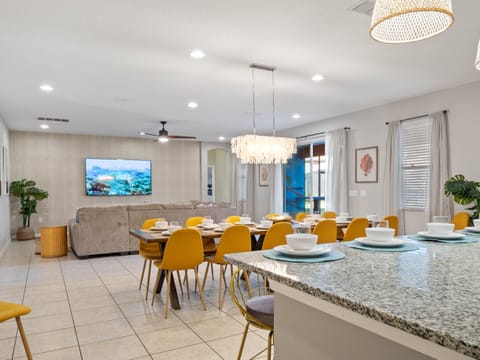 - Open living area with dining and kitchen views  
- Bright Florida rental with cozy seating and TV  
- Vacation home perfect for families and groups stay
