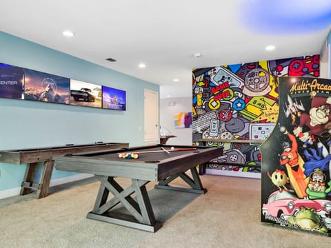 Super Fun Game room with pool table, shuffleboard, bubble hockey, wet bar, giant scrabble, and classic arcade