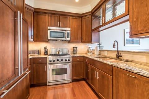 The kitchen features high-end stainless appliances perfect for the chef in your group