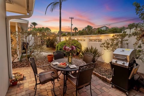 Outdoor patio with a BBQ grill. Enjoy a relaxing dinner after a perfect beach day!