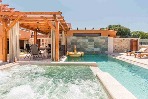 Private pool and jacuzzi in a Croatian luxury family villa with sauna and parking
