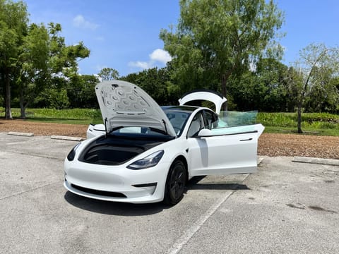 Rent our 2023 Tesla Model 3 (booked through Turo separately for additional fee).