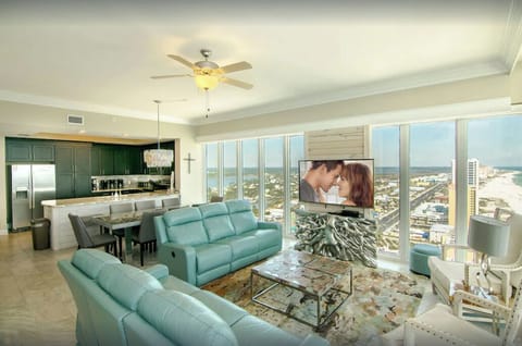 Living Room, Penthouse, Beach View, Couches, TV, Dining Table, Ceiling Fan.