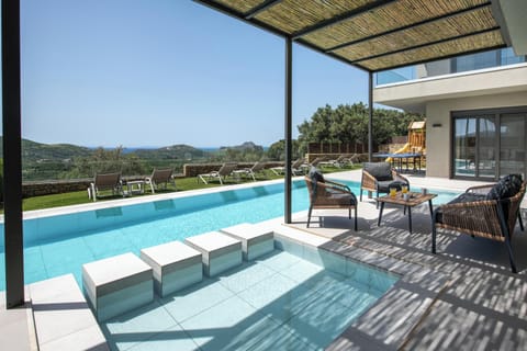 Poolside seating area with a dedicated kids’ pool section.