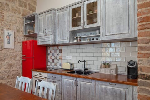Equipped kitchen in rustic style in seafront luxury villa Vis for total privacy by the sea.
